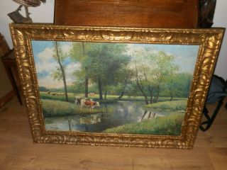Large old oil painting,  Landscape with cows,  and trees,  great frame.  Is antique 10