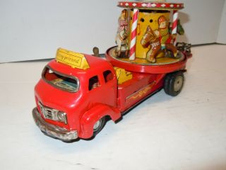 Vintage Japan TN Tin Battery Op.  1950 ' s Merry Go Round Carousel Truck.  RUNS.  NR 2