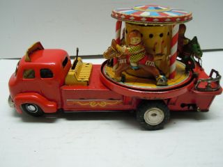 Vintage Japan TN Tin Battery Op.  1950 ' s Merry Go Round Carousel Truck.  RUNS.  NR 6