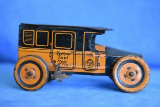 Antique Lithograph Yellow Taxi Main 7570 J.  Chein & Co.  Wind Up Tin Cab Toy