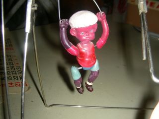 antique celluloid trapeze artist ' s swing toy 3