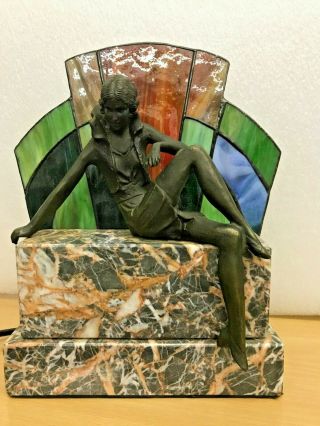 Art Deco Style Spelter Figurine Seated On Marble Plinth With Back Light