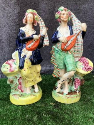 Pair: Mid 19thc Staffordshire Scottish Male & Female Figurines C1860s