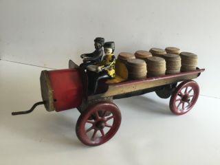 Tin Wind Up Wagon With Drivers And Wooden Barrels
