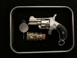 Miniature 2mm North American Arms style 1 : 2.  3 single action 5 shots revolver 4