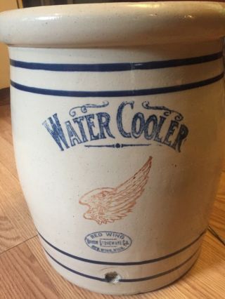 5 gal.  Antique redwing water cooler.  Union company.  4 1/2 in.  Wing.  5 inside 2