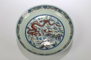 A Porcelain Plate With Dragon And Phoenix In Fencai Polychrome Enamels