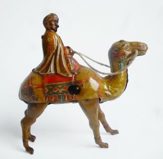 Vintage Tin Litho Wind up Wiseman on a Camel Made in Germany U.  S.  Zone RARE 2