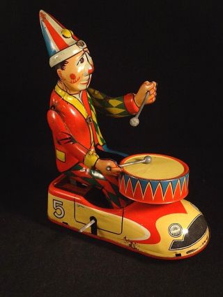 Vintage tin toy wind - up clown circus bump car drum HWN Nuremberg W.  Germany 1950s 2