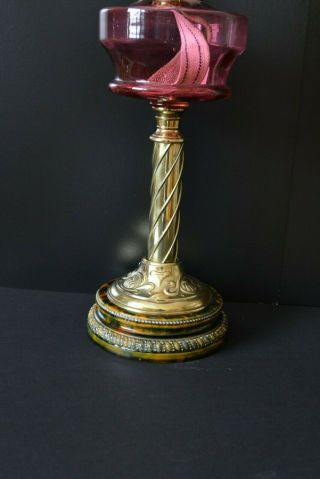 Victorian twin burner oil lamp.  cranberry font and shade 2