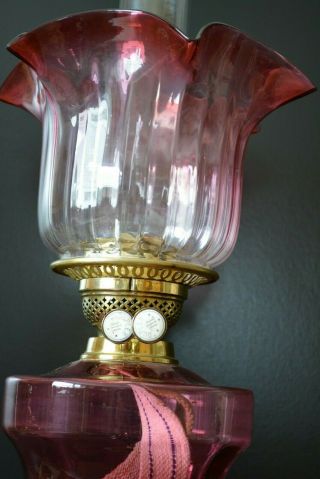 Victorian twin burner oil lamp.  cranberry font and shade 3