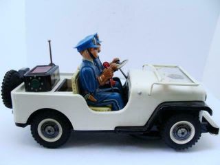 Nomura TN Police Patrol Jeep Battery Operated Tin Toy car boxed near 2