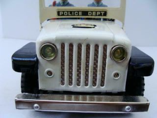 Nomura TN Police Patrol Jeep Battery Operated Tin Toy car boxed near 4