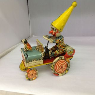 VINTAGE UNIQUE ART MFG.  CO.  ARTIE THE CLOWN Tin Wind Up Toy Car.  610 - G 2