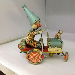 VINTAGE UNIQUE ART MFG.  CO.  ARTIE THE CLOWN Tin Wind Up Toy Car.  610 - G 5