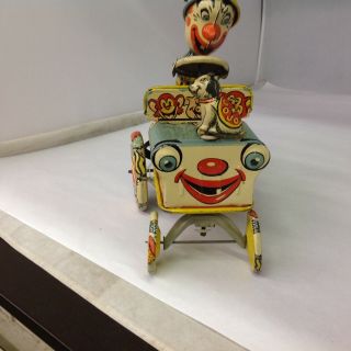 VINTAGE UNIQUE ART MFG.  CO.  ARTIE THE CLOWN Tin Wind Up Toy Car.  610 - G 7