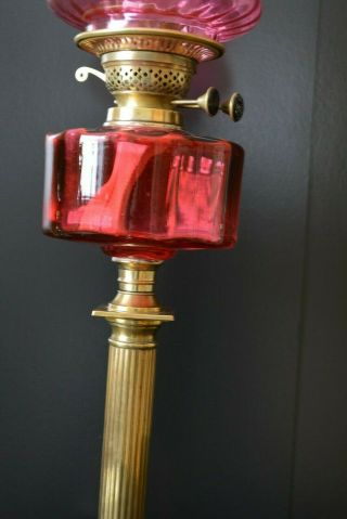 Victorian twin burner oil lamp.  cranberry font.  and shade 2