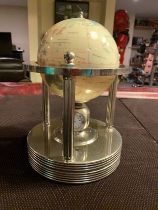Mother Of Pearl Gemstone Globe Rotating Clock.  Goldtone