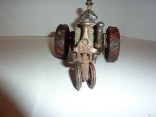 CAST IRON INTERATIONAL FARM TRACTOR.  ALL CAST IRON 6 - 1/2 INCH 5