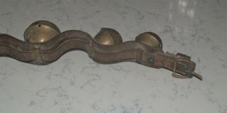 ANTIQUE STRAND OF LARGE HORSE BRASS SLEIGH BELLS ON LEATHER STRAP 10