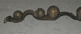 ANTIQUE STRAND OF LARGE HORSE BRASS SLEIGH BELLS ON LEATHER STRAP 6