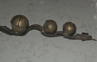 ANTIQUE STRAND OF LARGE HORSE BRASS SLEIGH BELLS ON LEATHER STRAP 7