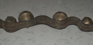 ANTIQUE STRAND OF LARGE HORSE BRASS SLEIGH BELLS ON LEATHER STRAP 9