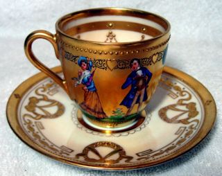 A Ambrosius Lamm Dresden Antique Gold Hand Painted Courting Couple Cup & Saucer