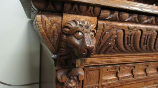 Antique Heavily Carved Oak Cabinet with Lions and Figures 11
