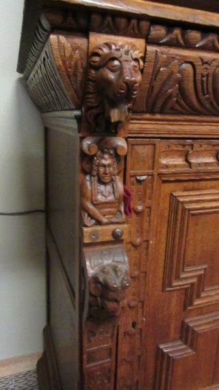 Antique Heavily Carved Oak Cabinet with Lions and Figures 7