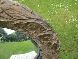 Antique mirror,  round with leaf pattern,  convex glass. 4