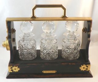 Miniature Tantalus.  Coromandel Wood Frame With Three Cut Glass Bottles.  19th C