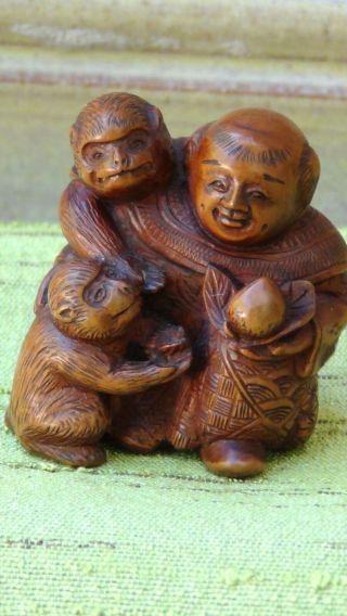 Old Japanese Carved Wood Netsuke Man With Peach And Two Monkeys