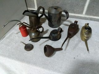 96.  Assortment Of Antique Vintage Oil Cans And Funnels