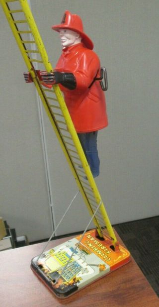 Vintage Marx Climbing Fireman Wind Up Ladder Toy