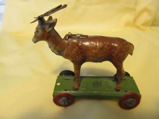 Ces Cesch Tin Reindeer Nodder Toy On Wheels