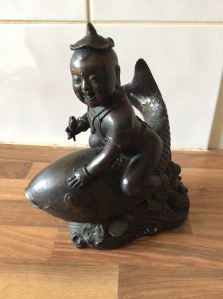 Chinese Bronze Figurine Of Man Riding A Fish