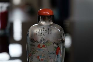 AN INSIDE - PAINTED CRYSTAL SNUFF BOTTLE.  WITH CORAL TOP. 7