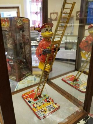 Vintage Walt Disney Donald Duck Climbing Fireman,  Tin Wind Up Toy Linemar Marx
