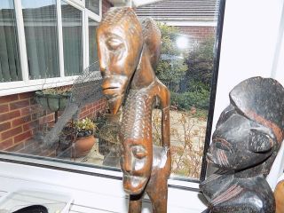 4 X VINTAGE HAND CARVED WOODEN TRIBAL AFRICAN FIGURES LARGEST 31.  75 cm tall 10