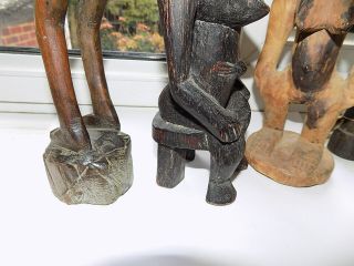 4 X VINTAGE HAND CARVED WOODEN TRIBAL AFRICAN FIGURES LARGEST 31.  75 cm tall 12