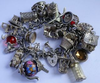 Stunning vintage solid silver charm bracelet & 27 charms.  rare,  open,  move.  106.  5g 10