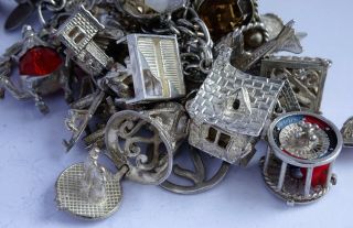 Stunning vintage solid silver charm bracelet & 27 charms.  rare,  open,  move.  106.  5g 2
