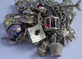 Stunning vintage solid silver charm bracelet & 27 charms.  rare,  open,  move.  106.  5g 4