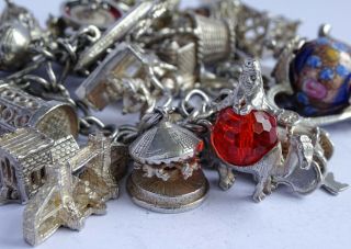 Stunning vintage solid silver charm bracelet & 27 charms.  rare,  open,  move.  106.  5g 6
