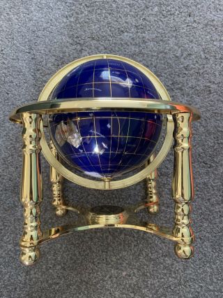 Globe Of The World Mounted On A Brass Stand With Compass