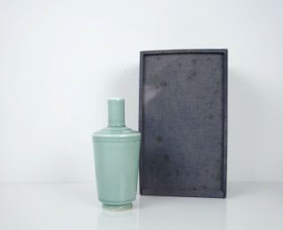 A Celadon Glazed Bottle Vase With A Fitted Box