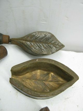 THREE BRONZE LEAF MOLDS,  MILLINERY FLOWER IRONS,  AFT.  TOOL AND ? 5