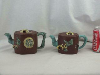 Two Antique Chinese Yixing Moulded Enamelled Teapots - Marks To Lid And Base
