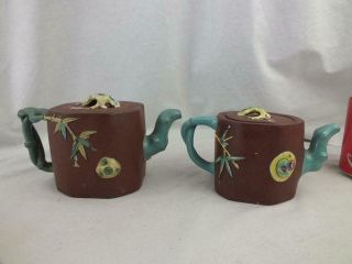 TWO ANTIQUE CHINESE YIXING MOULDED ENAMELLED TEAPOTS - MARKS TO LID AND BASE 3
